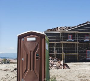 regular porta potty at a new construction job site